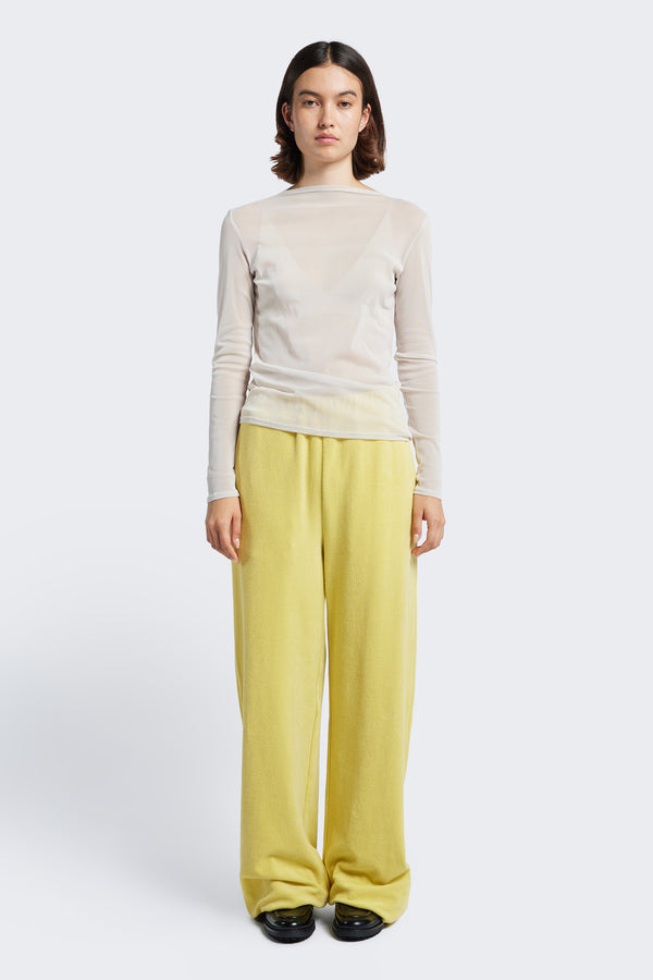 The Prone Towelling Track Pant Butter is a slouchy track pant with an elasticated waist band and crafted from Okeo-tex standard cotton terry.