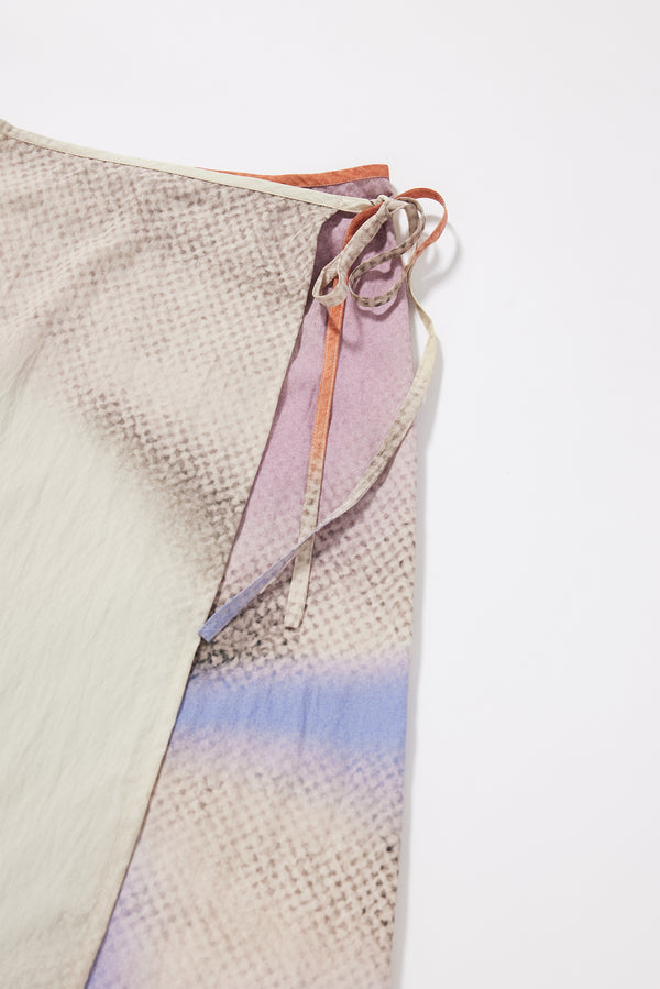 Close-up of button fastening and self-tie waist detail on the Purview Skirt in Aion Print rayon-nylon blend