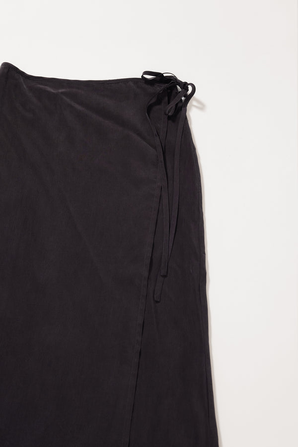 Close-up of button fastening and self-tie waist detail on the Purview Skirt in Vintage Black Cupro