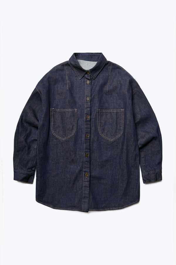 The front of the Recess Denim Shirt with a relaxed silhouette and front button through detail. Features two front patch pockets at the chest. Crafted from Japanese denim in rinsed Wash Indigo. 