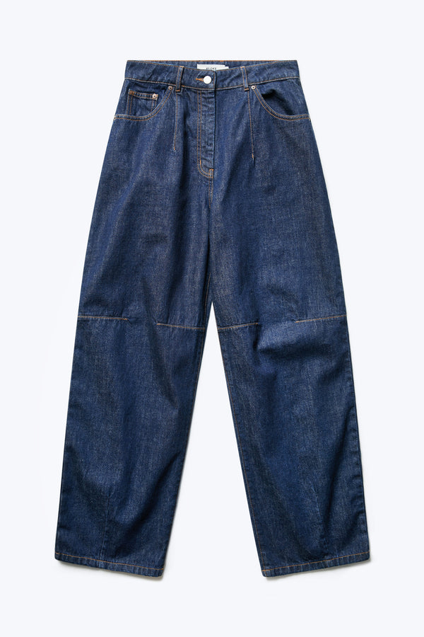 The front of the Reset Baggy Jean Indigo is a darted relaxed baggy jean cut from Japanese denim. Features two darts at the centre front waistline and darts across the knee and five pockets. 