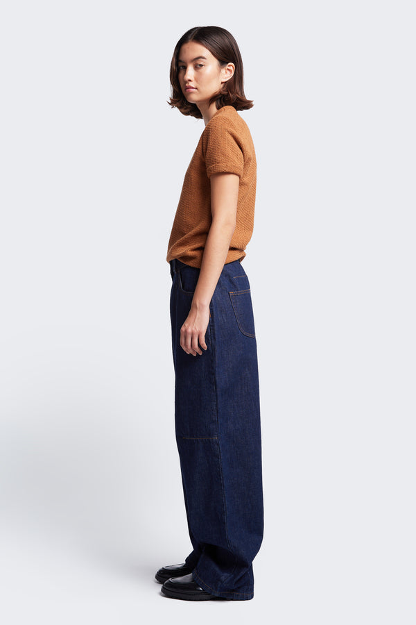 Side profile of the Reset Baggy Jean Indigo. Cut from Japanese denim, these darted, relaxed baggy jean are comfortable.