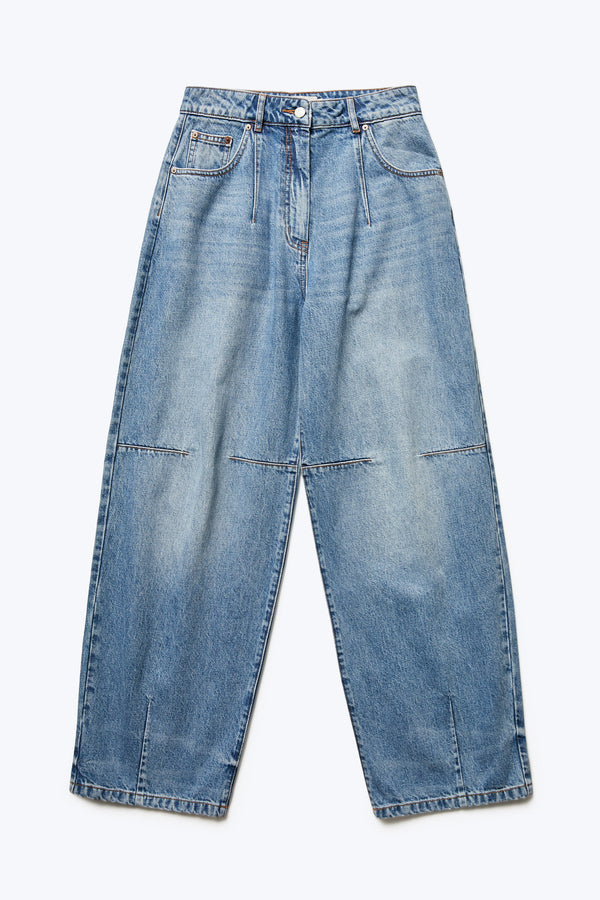 The front of the Reset Baggy Jean Mid Blue Wash is a darted relaxed baggy jean cut from Japanese denim. Features two darts at the centre front waistline and darts across the knee and five pockets. 