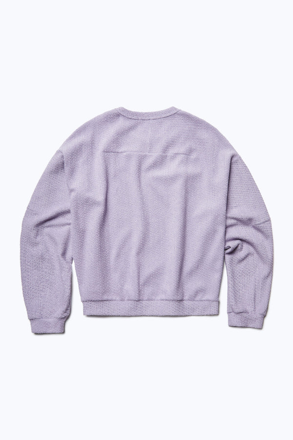 The back of the Respite Sweater, a cropped style jumper in a loop front jersey in Lilac Purple. Features back straight dart detail.