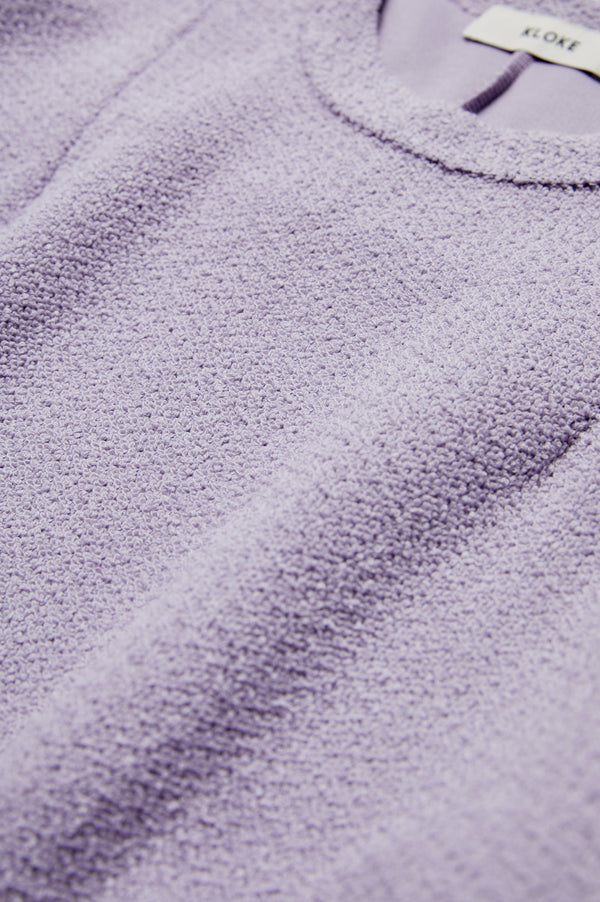 The Respite Sweater Lilac in jersey with a textured loop weave. 