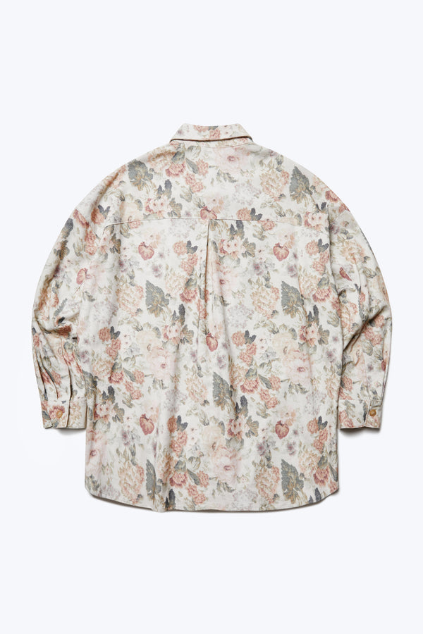 The back of the Resting Cord Shirt Floral, a long sleeve shirt with a relaxed silhouette, stand collar and scoop hem. Made from a fine wale corduroy. 