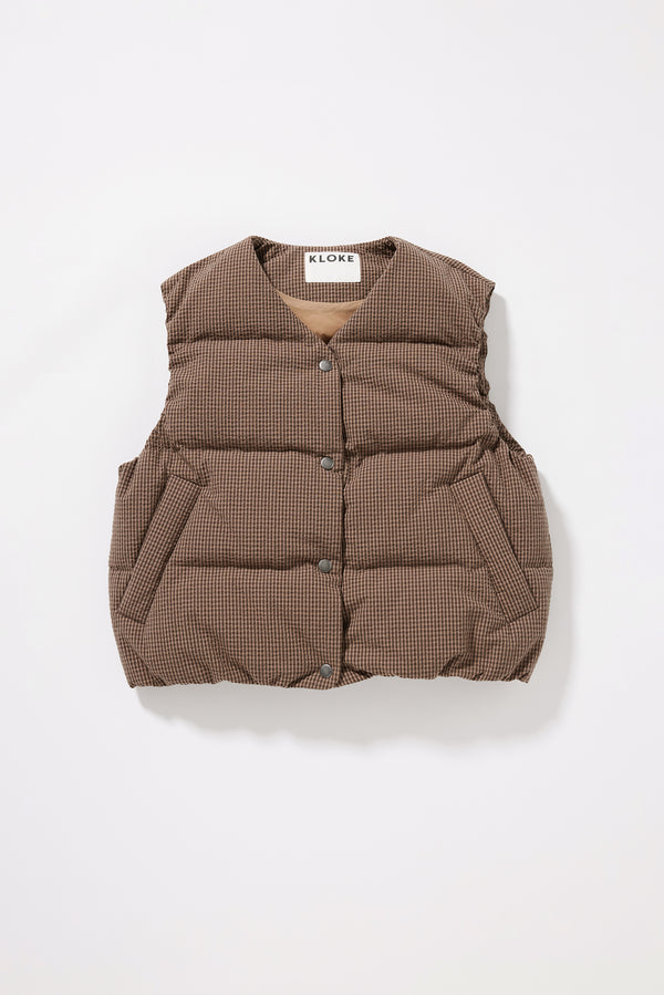 Flat front of the brown Quilted down vest with a V-neck, snap-front closure and front welt pockets.