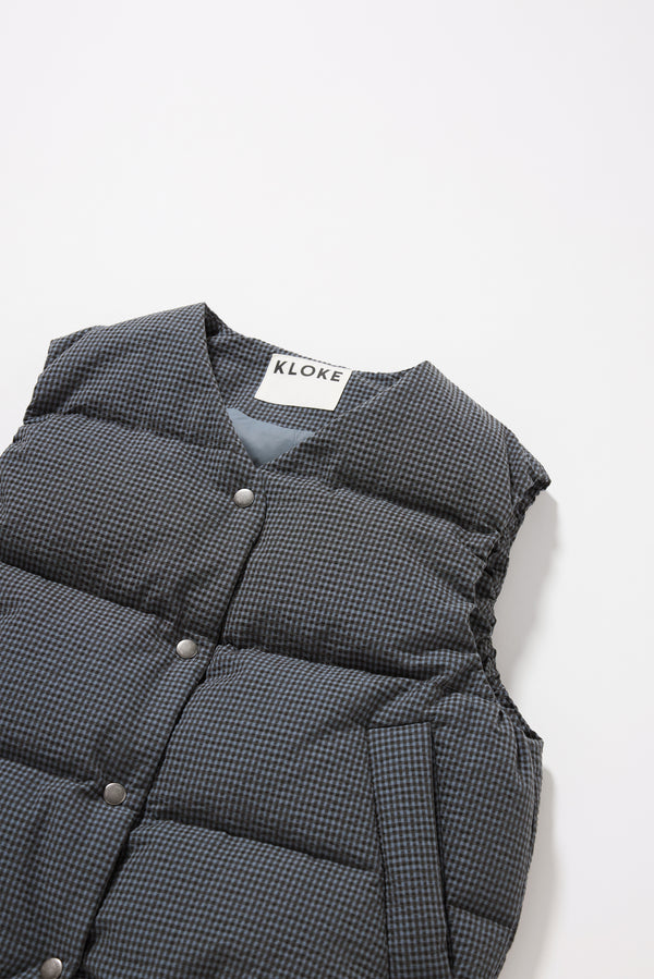 Close-up of Kloke's signature seersucker gingham in ink blue showing the textured surface and dry, paper-touch finish.