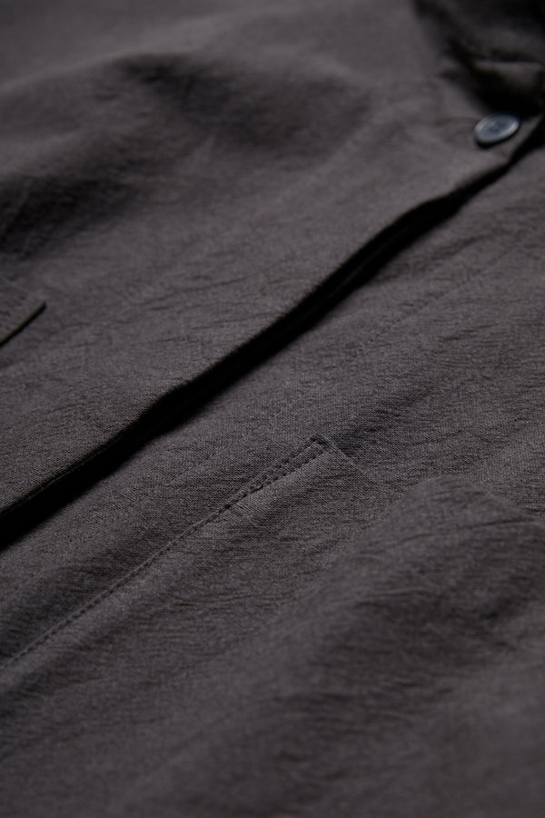 The Tenet Blouson Shirt is crafted from a textural cotton fabric in Black and has a centre concealed button placket.