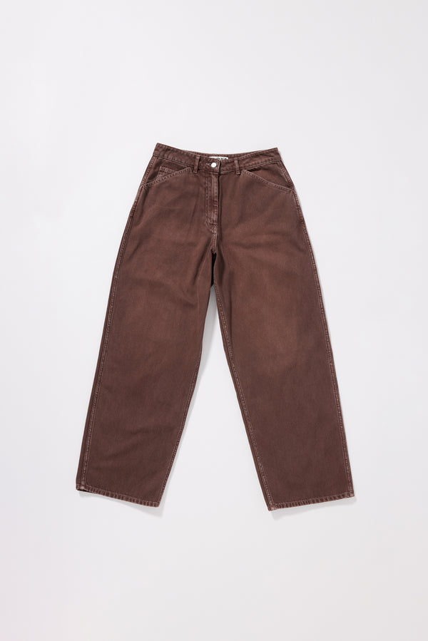 Flat front of the brown fade Unbound Jean in 12oz denim with a relaxed baggy fit, slant pockets and an oversized coin pocket.