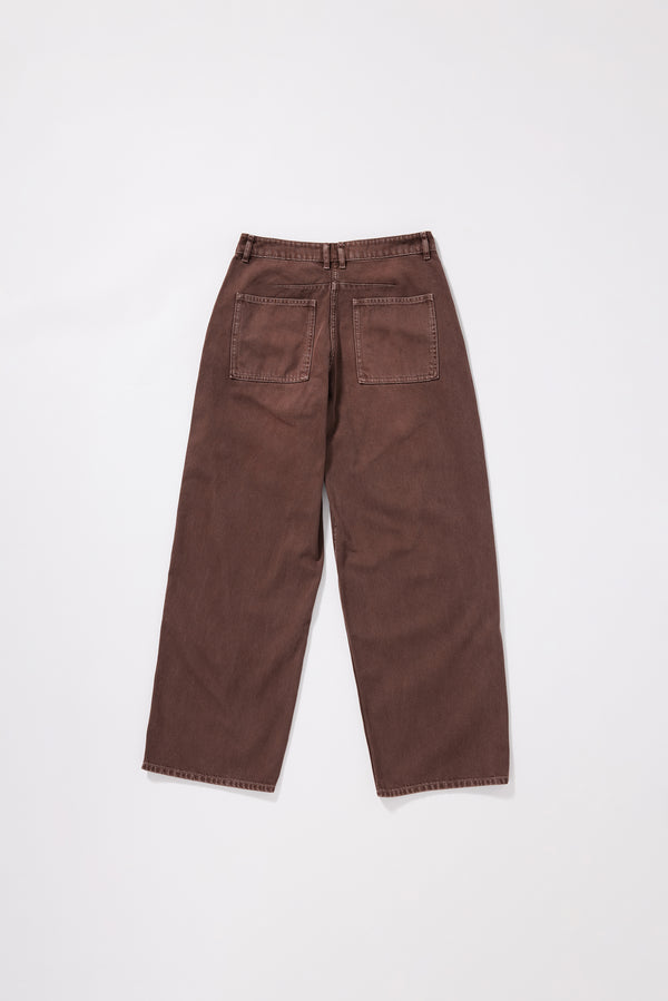 Flat Back view of the brown fade Unbound Jean featuring large patch pockets and a relaxed silhouette.