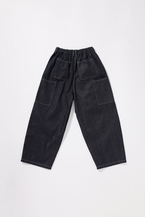 Flat Back view of  dark indigo relaxed cargo pants featuring patch pockets and premium Japanese denim construction.