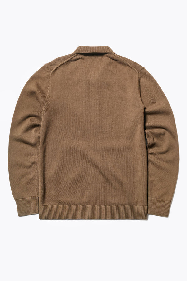 Back of The Anvil Collar Cardigan in Brown Olive, a heavier cotton knit styled as a jacket or cardigan, featuring a built-in collar, practical front pockets. Available in 5 sizes. 