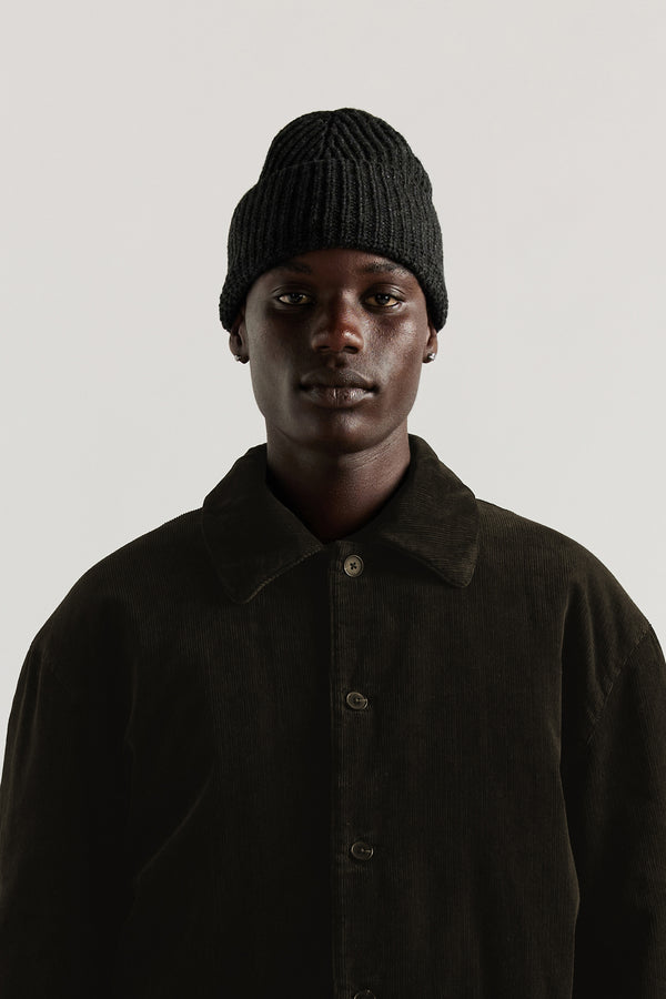 Men - Charcoal Fading Beanie worn on model, showing contemporary shape and ribbed half-cardigan knit construction in RWS certified Merino