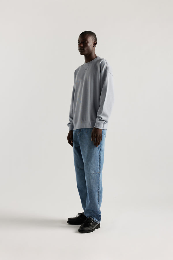 Side  of Kloke baggy Grail Japanese denim jeans showing darted waist and knee