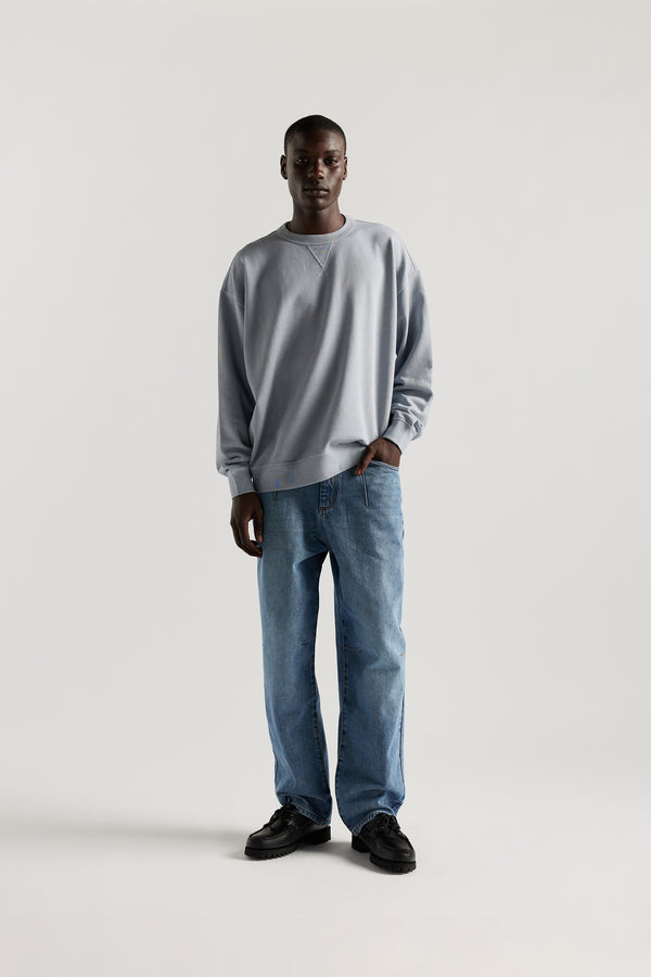Front  of Kloke baggy Grail Japanese denim jeans showing darted waist and knee