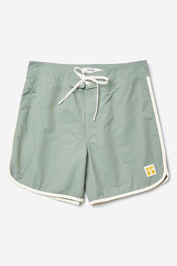 The Hybrid Board short in Sage Green, made from a functional technical cotton/nylon thats durable, stashable and quick-drying. Featuring back patch pocket with Velcro closure. Available in 5 sizes. 