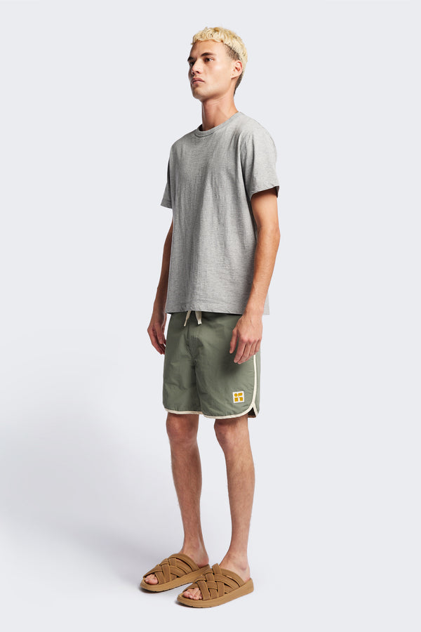 The Hybrid Board short in Sage, made from a functional technical cotton/nylon thats durable, stashable and quick-drying. Featuring back patch pocket with Velcro closure. Available in 5 sizes. 