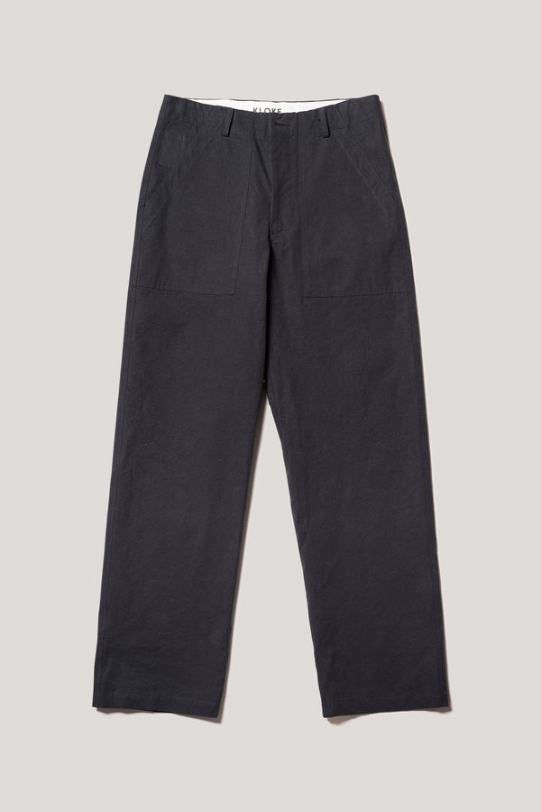 Flat front of the Black Lenz Pant with straight-leg silhouette, front patch pockets and twin-needle topstitch detail.