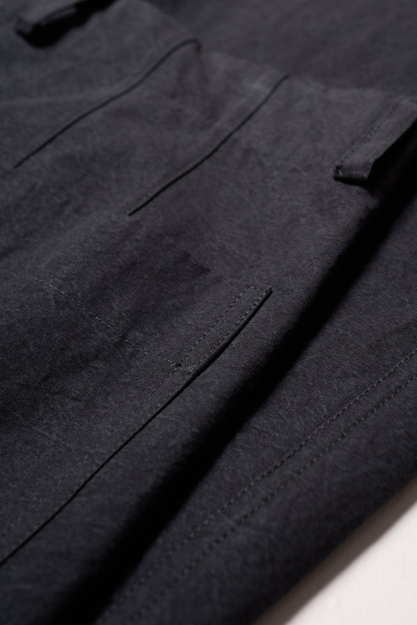 Close up shot of the fabric and pocket detailing on the Black Lenz Pant with straight-leg silhouette, front patch pockets and twin-needle topstitch detail.