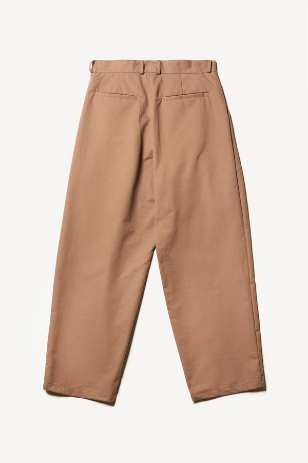 Flat back shot of the logic pleat pant in clay, A relaxed cotton trouser with pleated front and tapered leg