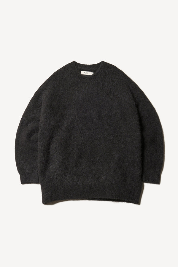 Flat Front of the Marlin oversized fluffy alpaca knit crew neck sweater in black. 
