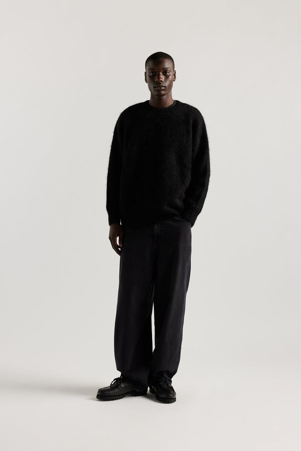Front of Male Model wearing oversized brushed alpaca blend knit crew neck sweater in Black 