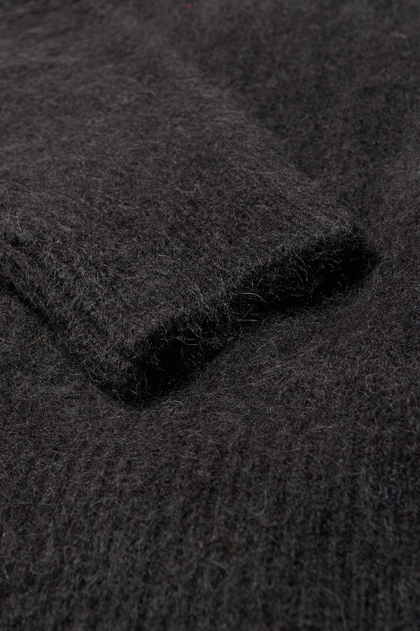 Close up fabric detail of the Marlin, oversized fluffy alpaca knit crew neck sweater in black 
