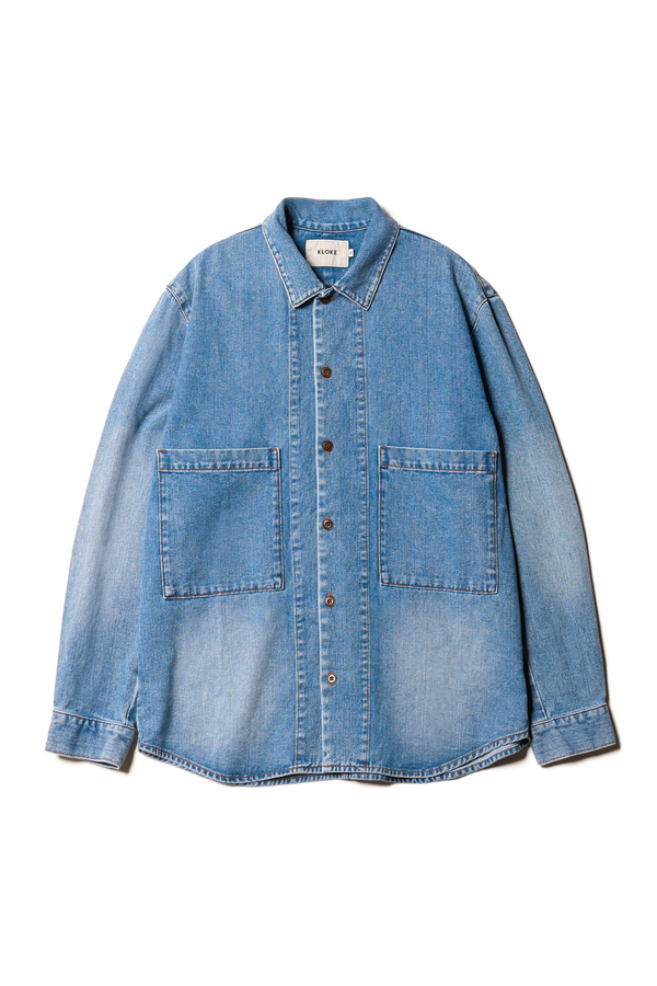 Flat Front view of the Mascot relaxed fit denim shirt in mid-blue, featuring utility chest pockets.