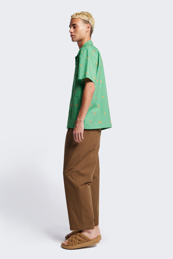 Side of the Mirari in Green floral, a relaxed short-sleeve open-collar camp shirt made from soft textured cotton seersucker, offering a laid-back fit. Available in 5 sizes. 