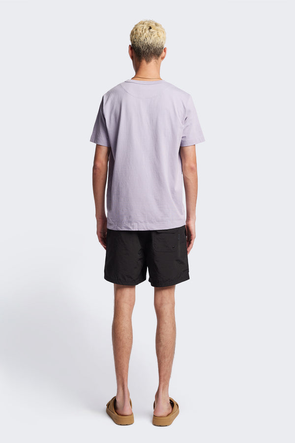 Back of The New Wave Short in Black. Swim shorts with elastic drawstring waist, internal mesh support, and front slant pockets. Available in 5 sizes.