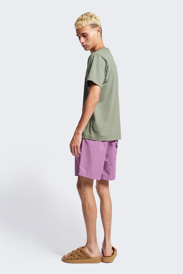 The New Wave Short in Purple Fade. With Utilitarian features like an elastic drawstring waist, internal mesh support, front slant pockets, and back patch pocket. Available in 5 sizes.