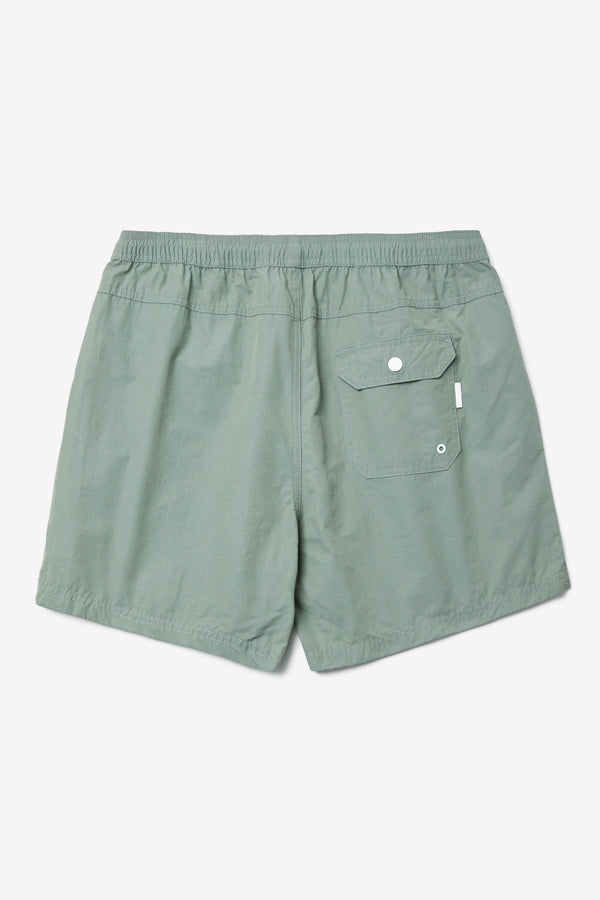 Back of The New Wave Short in Fatigue Green. Swim shorts with elastic drawstring waist, internal mesh support, and front slant pockets. Available in 5 sizes.