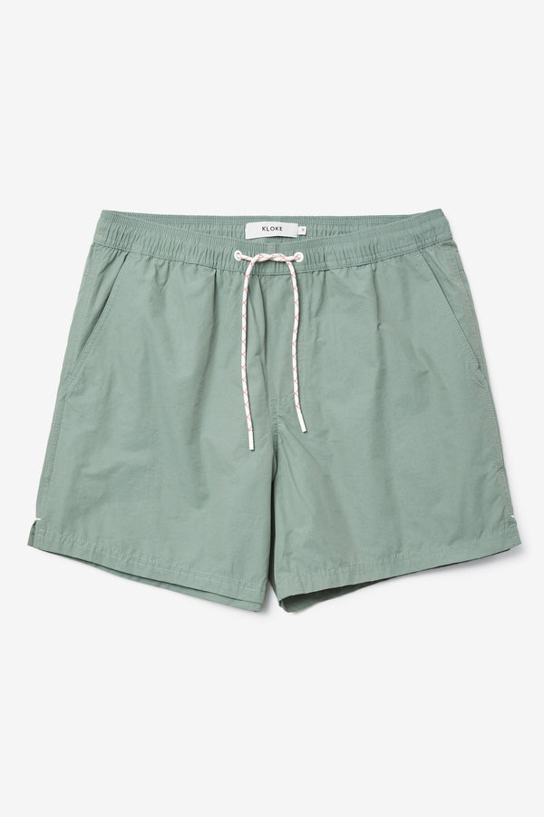 The New Wave Short in Fatigue Green. Swim shorts with elastic drawstring waist, internal mesh support, and front slant pockets. Available in 5 sizes.