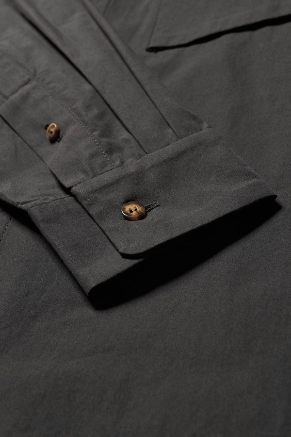 Close up cuff details shot of the Offset Shirt in a black heavyweight cotton, featuring a relaxed fit and utility chest pockets.