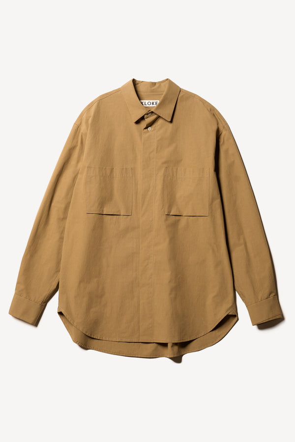 Flat Front of the Offset Shirt in a dusty olive heavyweight cotton, featuring a relaxed fit and utility chest pockets.