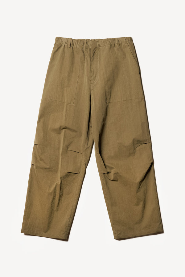 Flat front of the Output Pant in kelp green, a relaxed fit with wide tapered leg and clean patch pockets 
