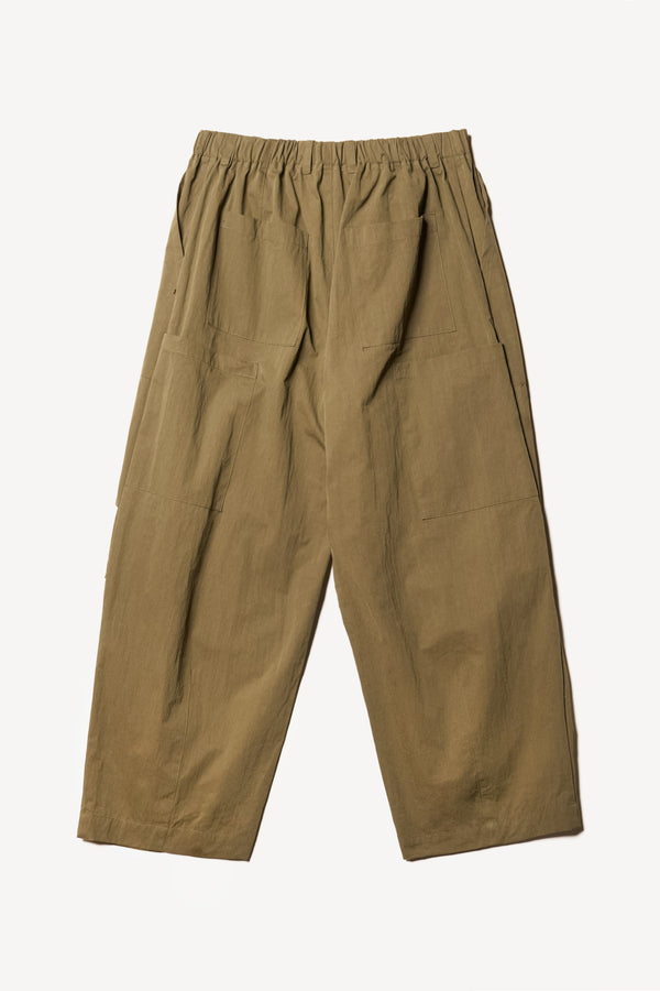 Flat back of the Output Pant in kelp green, a relaxed fit with wide tapered leg and clean patch pockets 