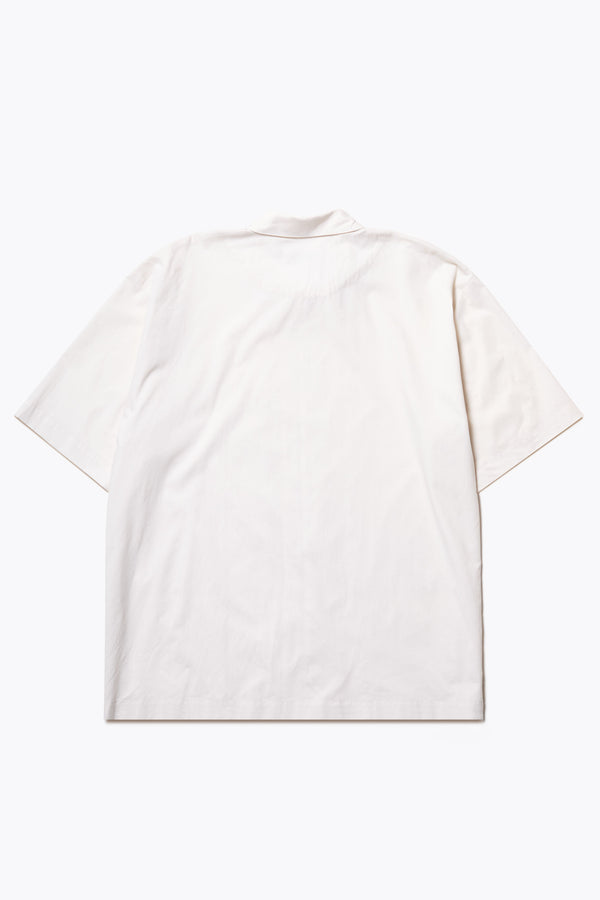 Flat Back of the Ecru Perisi shirt in lightweight micro ripstop cotton, featuring deep double patch map pockets at the chest, buttoned-up design, and a relaxed straight hemline. Available in sizes XS, S, M, L, and XL.