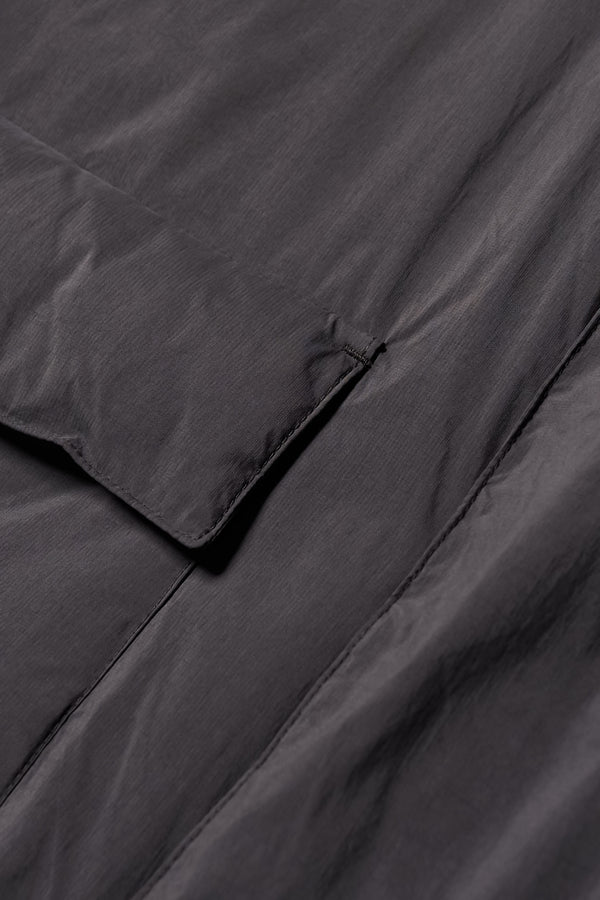 Close up pocket detail shot of the  Men’s Prospect Down Puffa a technical jacket with removable hood and utility pockets, made from recycled nylon. In Black