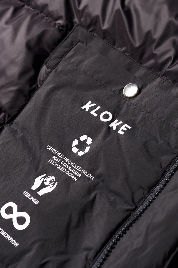 Close up inside pocket detail shot of the  Men’s Prospect Down Puffa a technical jacket with removable hood and utility pockets, made from recycled nylon. In Black