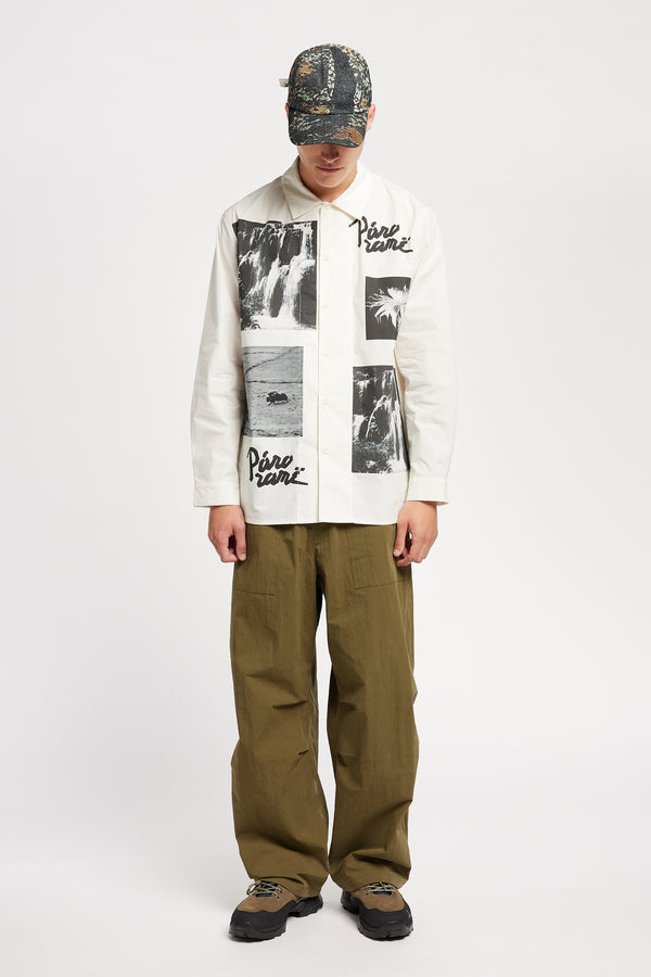 Front of Model wearing the Rame shirt, an off-white printed shirt with relaxed fit, structured collar, and vintage-photo placement print.