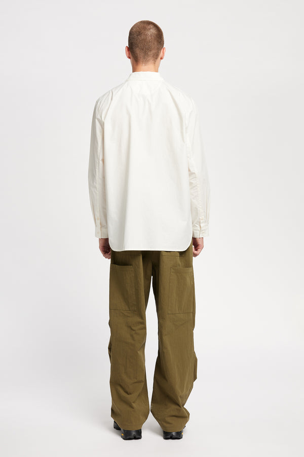 Back of Model wearing the Rame shirt, an off-white printed shirt with relaxed fit, structured collar, and vintage-photo placement print.