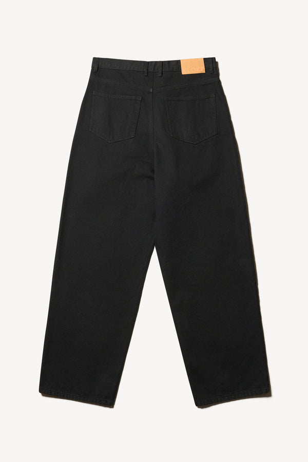 Flat back of the renew jean, a relaxed loose-fit straight style in premium Japanese denim, shown in black with five-pocket design and custom branded hardware.