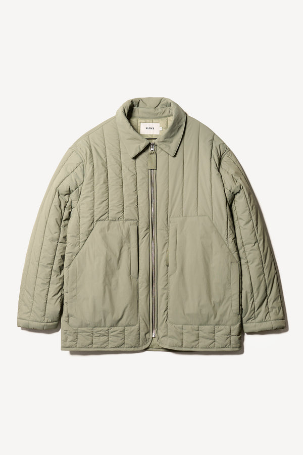 Flat front shot of the response quilted military field jacket with structured collar and concealed zip in dusty olive green