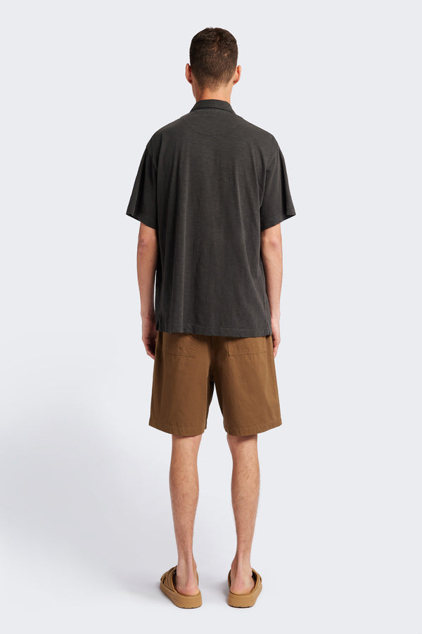 Back of The Tectonic Shirt in vintage black, a classic boxy fit T-Shirt made from 100% cotton garment dyed jersey with a reinforced back yoke. Available in 5 sizes. 