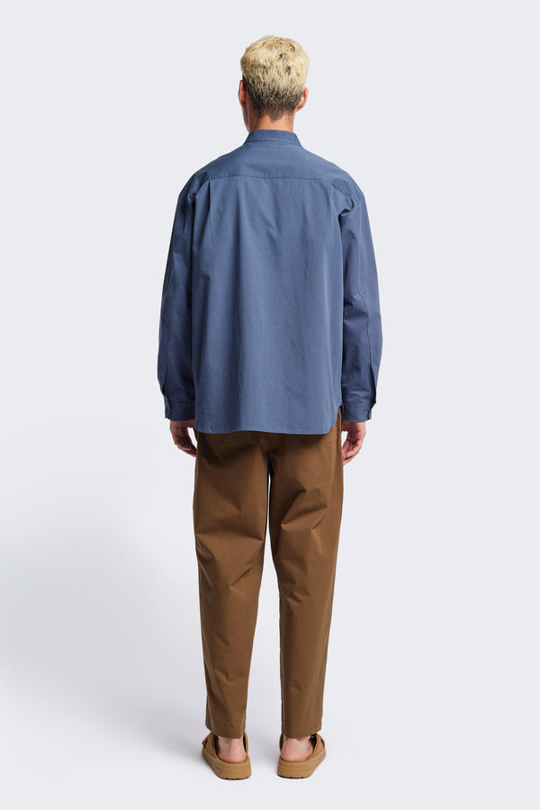 Back of the Blue Underground Long Sleeve Shirt in washed cotton herringbone twill with band collar and button placket. Available in 5 sizes. 