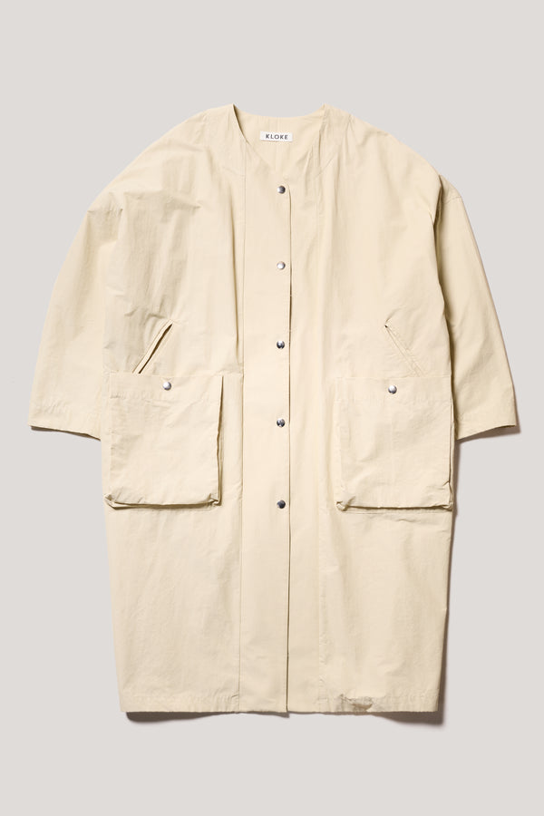 Flat Front view of the Stone Locate Jacket, with centre-front button closure and rounded neckline.
