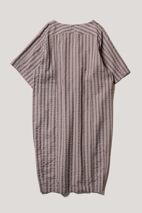 Flat Back of the Origin Dress in gingham seersucker brown check. A relaxed silhouette with internal tie, clean neckline, and subtle underarm split detail.