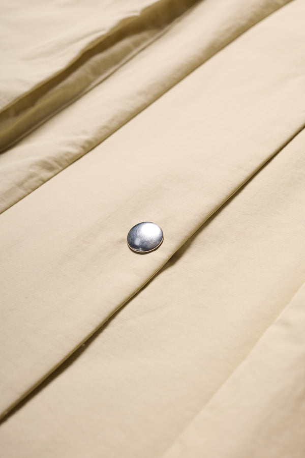 Detail of the Stone Locate Jacket’s centre-front button closure